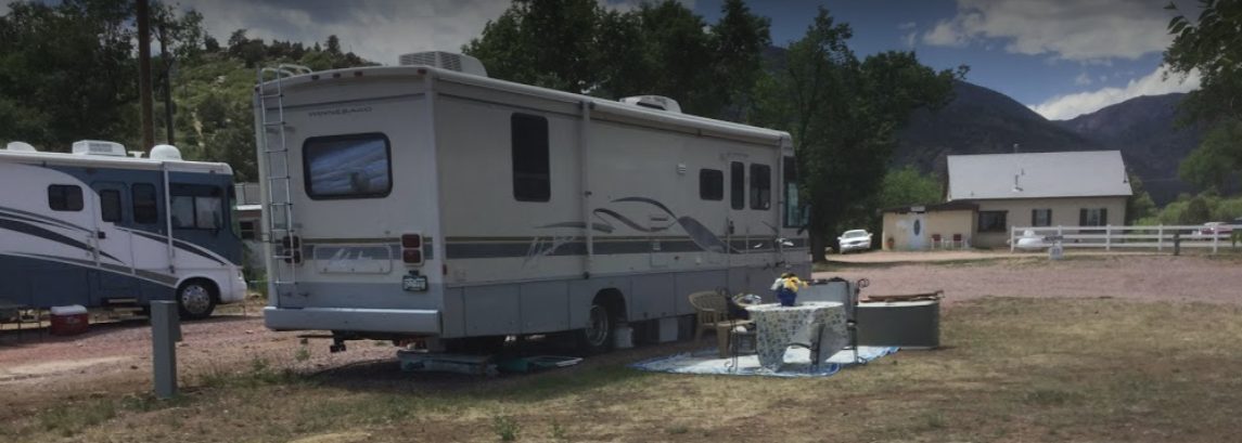 RVs settled in at full-hookup sites with a mountain backdrop at Sunview RV Park
